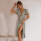 Fashionable women's midi dress with a deep V-neck and cutouts for autumn